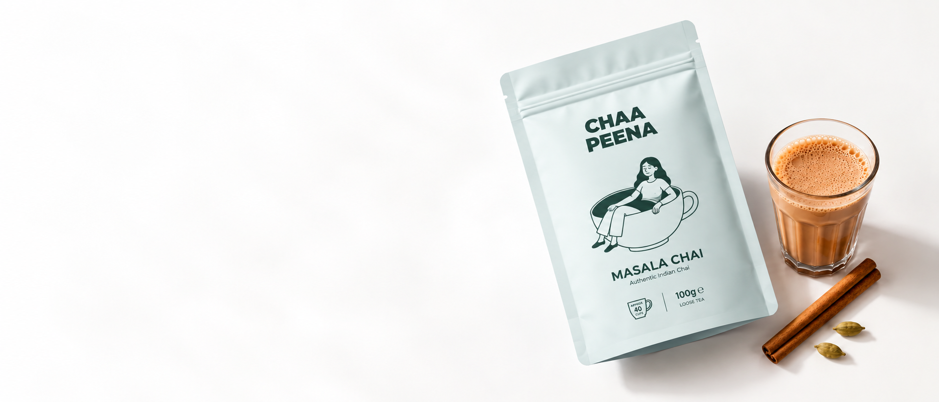 Chaa Peena masala chai pouch with a glass of chai, cinnamon sticks and cardamom pods