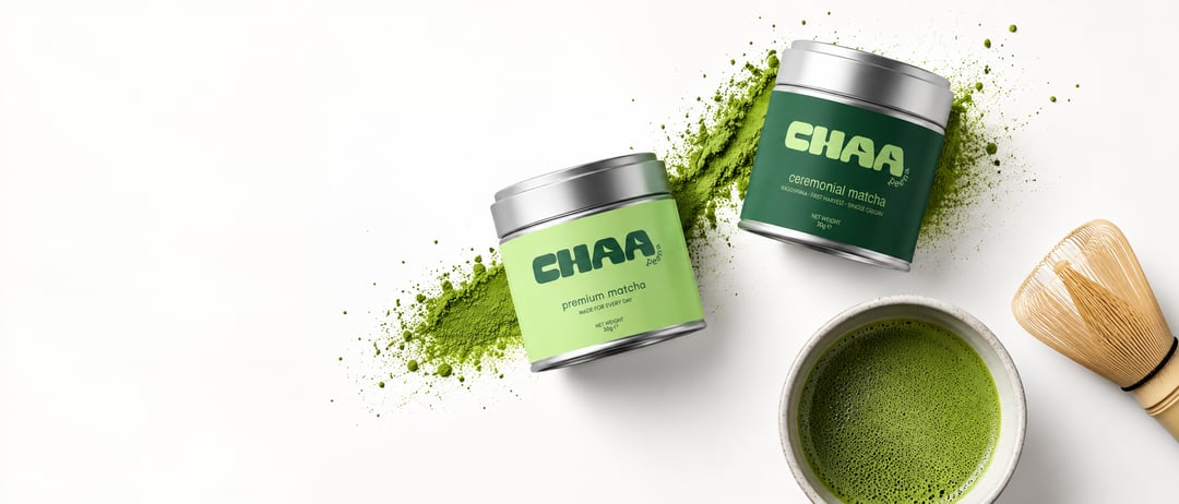 Chaa Peena premium and ceremonial matcha tins with a whisked bowl of matcha and bamboo whisk